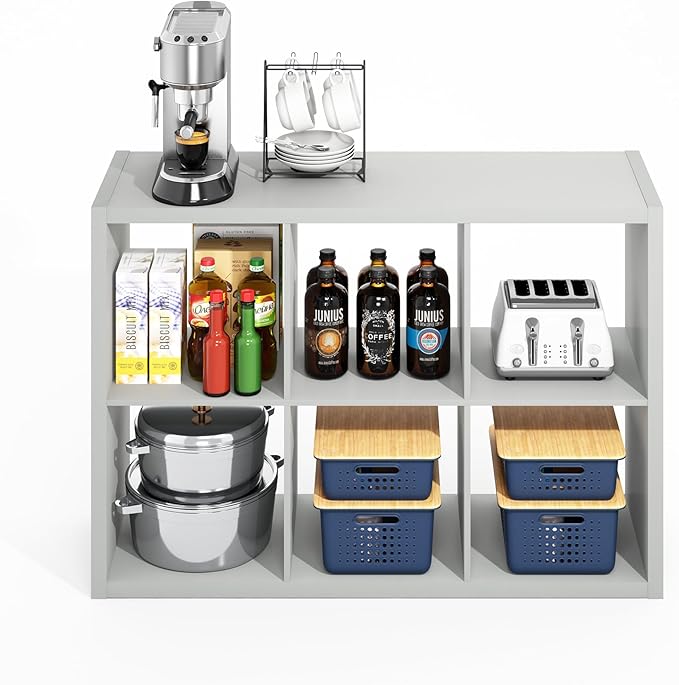 White kitchen shelf with various items including bottles, a toaster, and cookware.